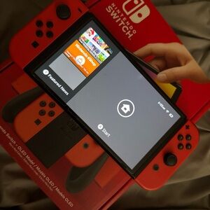 Gently Used Nintendo Switch.Mario Red Edition.